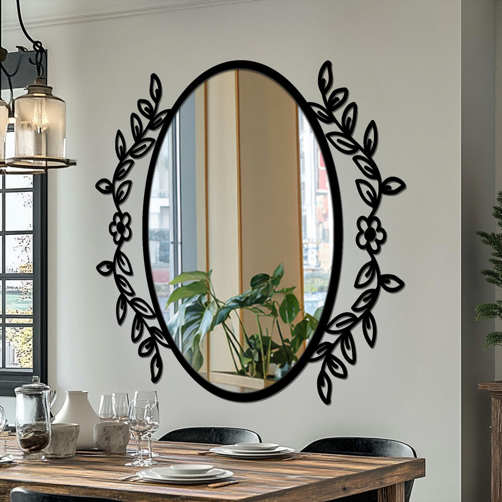 Black is the dominant color of this botanical elegance oval floor mirror, framed with a floral vine in a decorative metal artwork.