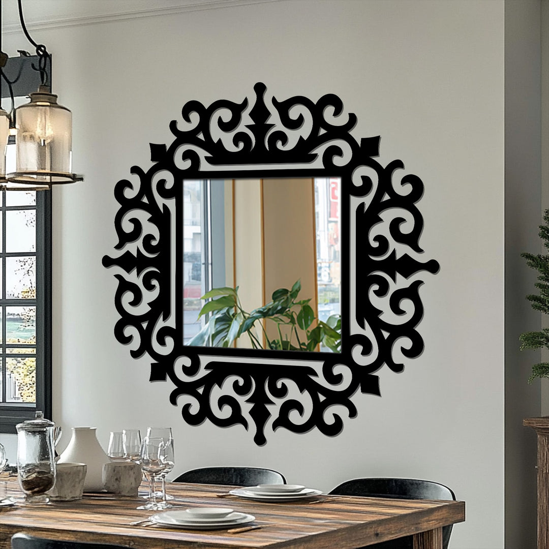Warm color temperature highlights the black ornate baroque frame around the square royal scroll modern wall mirrors hung on a neutral wall.