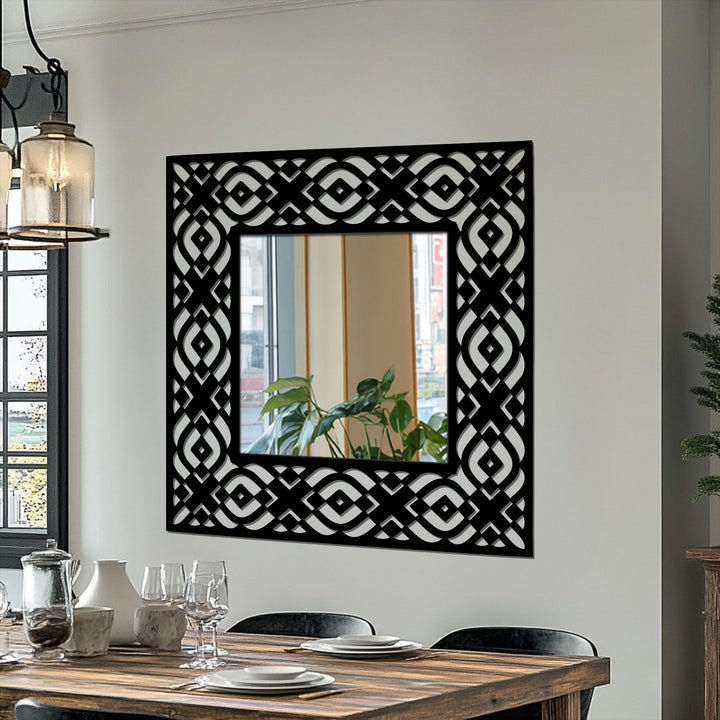 Black dominates this geometric tribal pattern square mirror, featuring a symmetrical openwork frame, adding bold metal wall decor to a contemporary space.