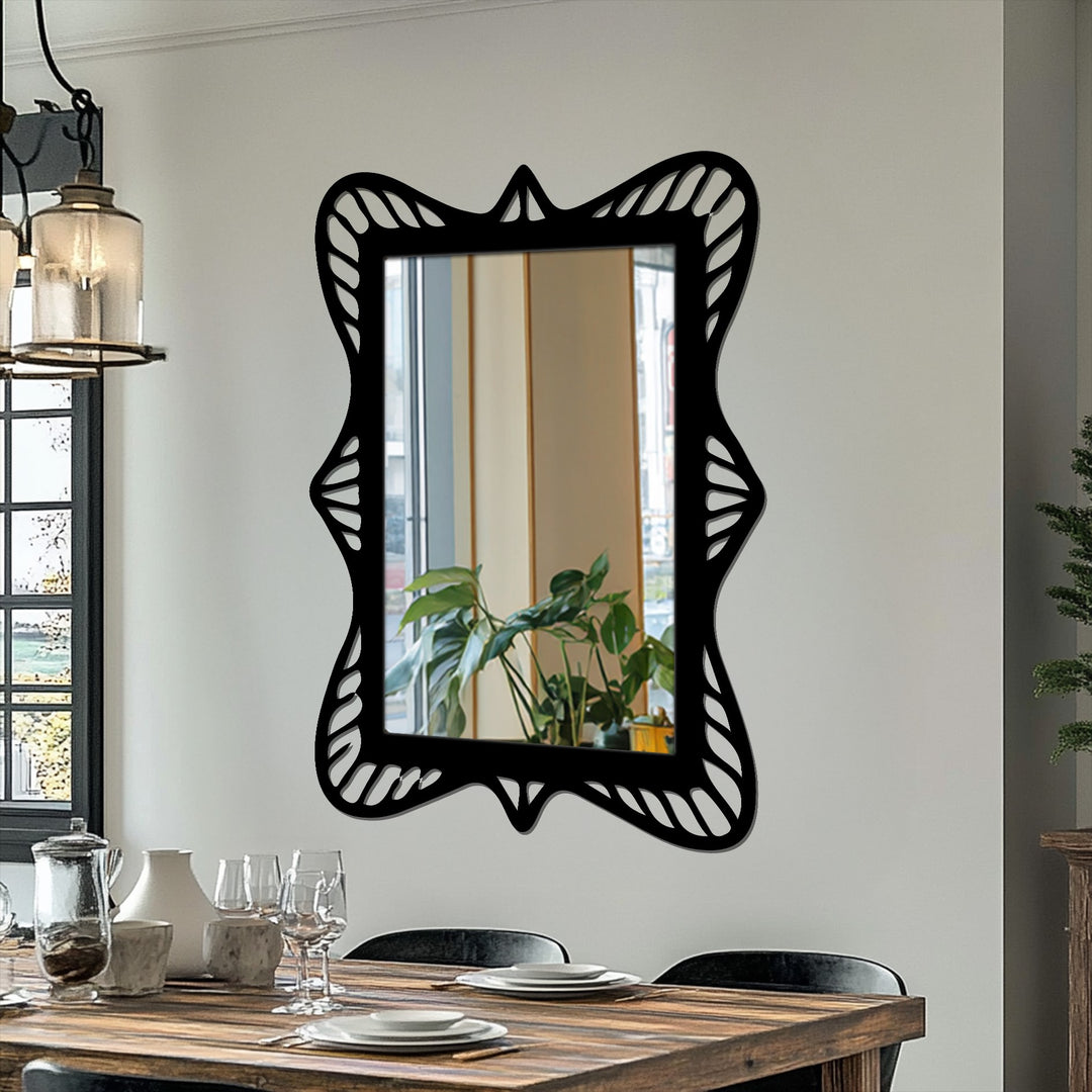 Strong color contrast showcases the black ornate wave frame of the rectangular framed wall mirror against the bright wall.