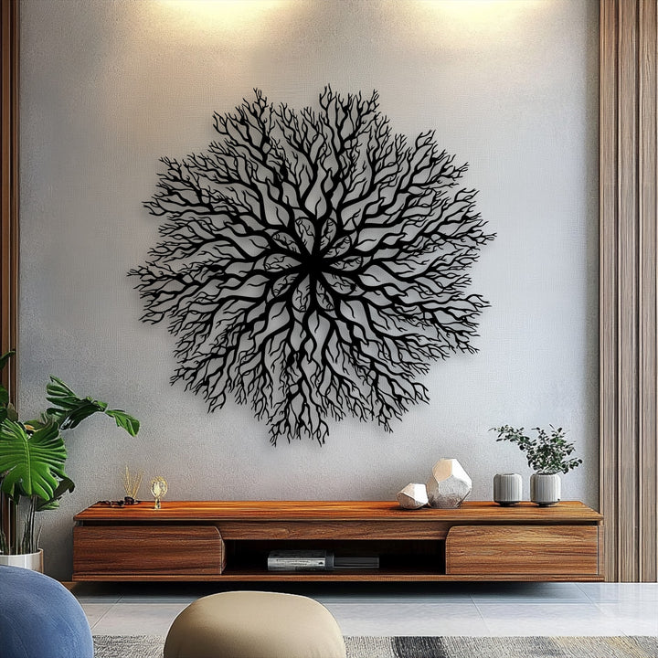 Striking depth and intricate layers define this black tree roots mandala metal artwork, prominently featured against a textured light grey wall.