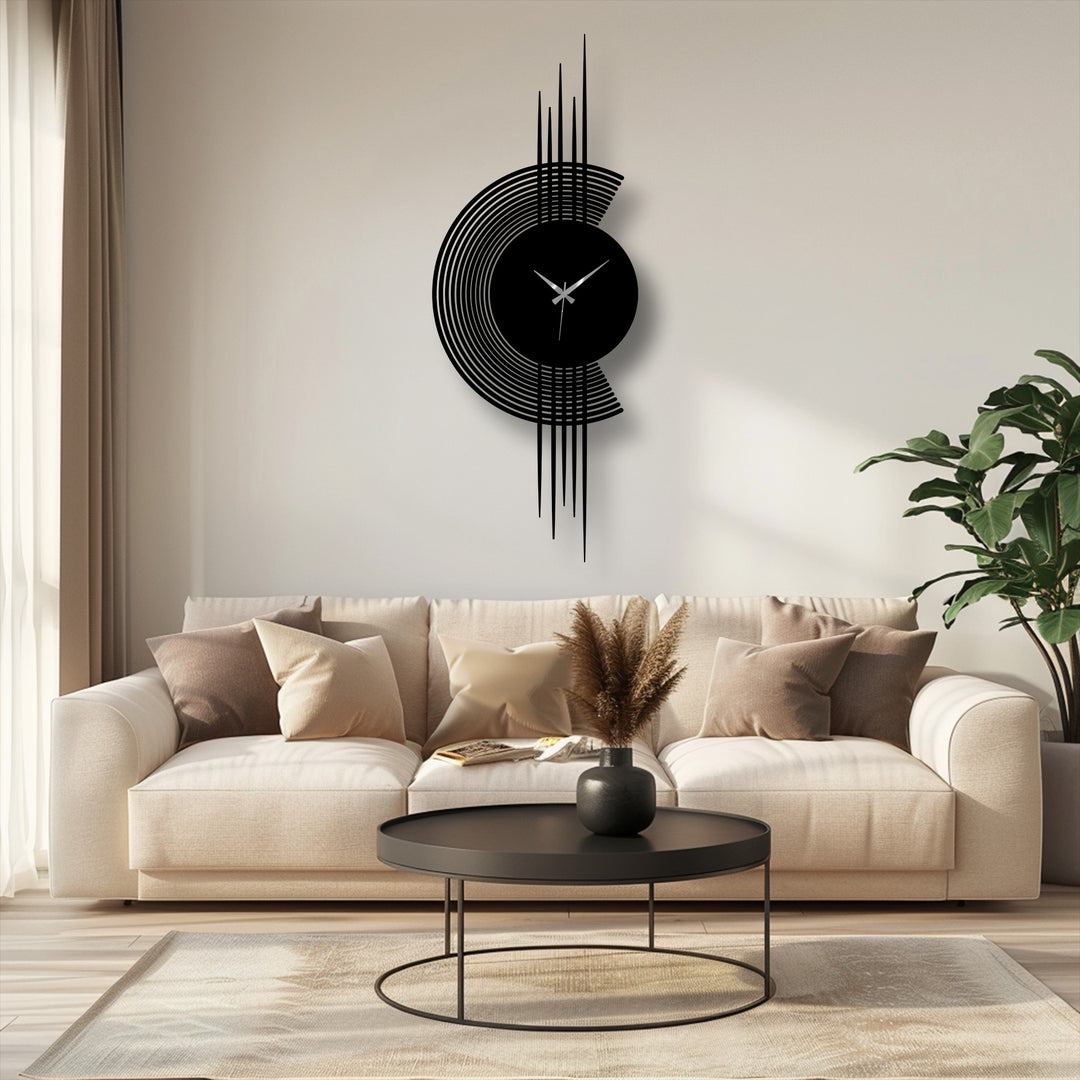 Shadows emphasize the color shift within this unique metal wall art clock as the arc line design descends into a stark vertical contrast.