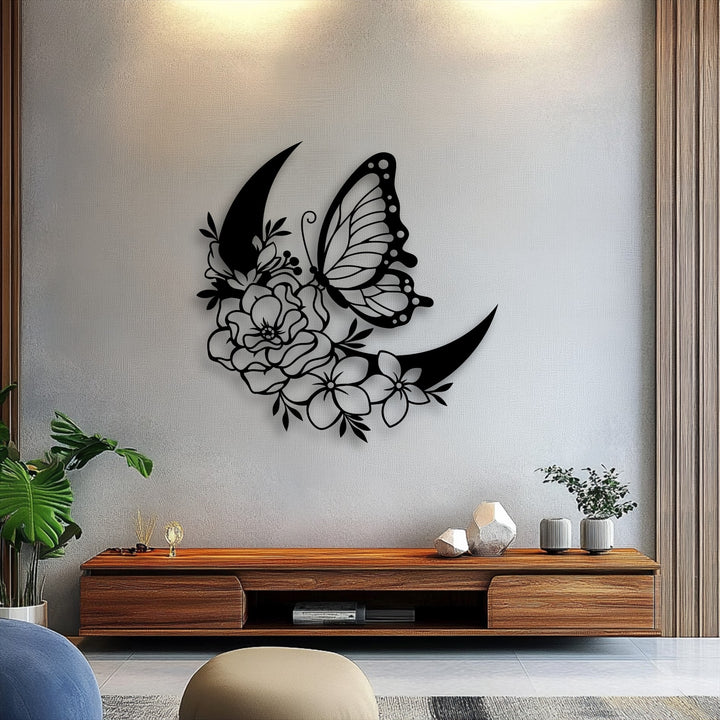 A subtle greige wall features a striking charcoal black unique metal wall art of a butterfly and floral crescent moon.