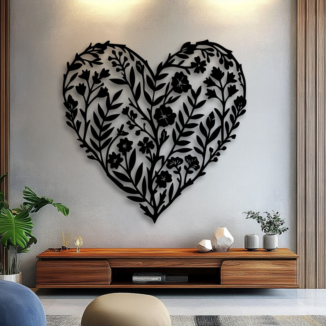 The stillness of the room is accentuated by the intricate black botanical heart floral metal artwork, creating a serene focal point above the console.