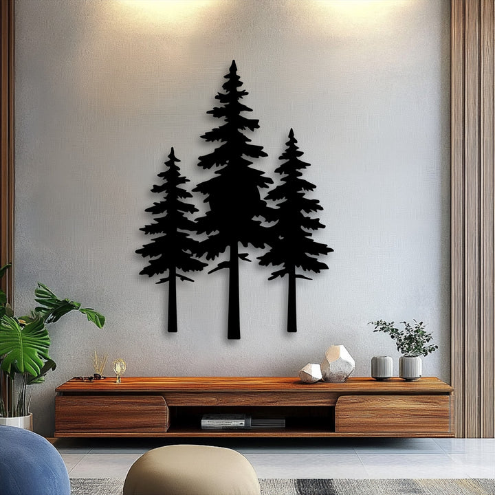 A striking black pine forest silhouette metal art for wall prominently displayed on a light gray wall above a modern wooden console.