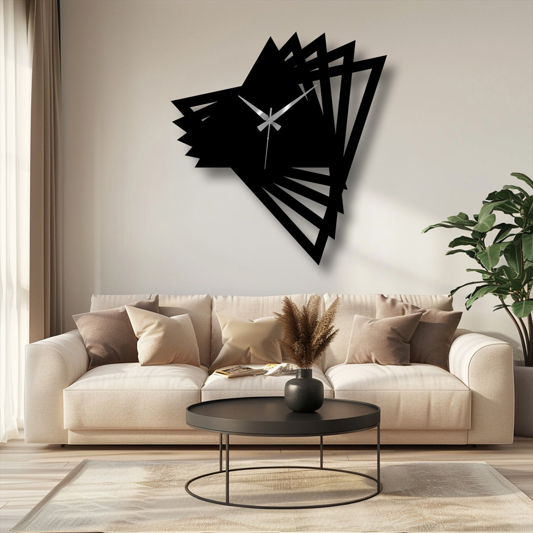 Bold color contrast defines this abstract origami geometric metal artwork clock mounted on the wall, a modern timepiece with striking black and white tones.