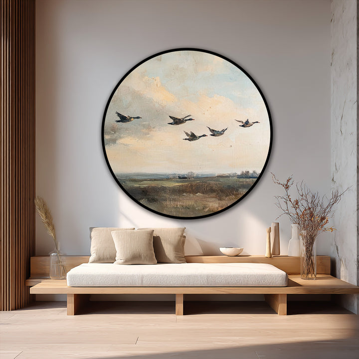 Visual rhythm is achieved with the flowing formation of ducks in this round oil painting art piece, creating a calming yet captivating landscape scene.