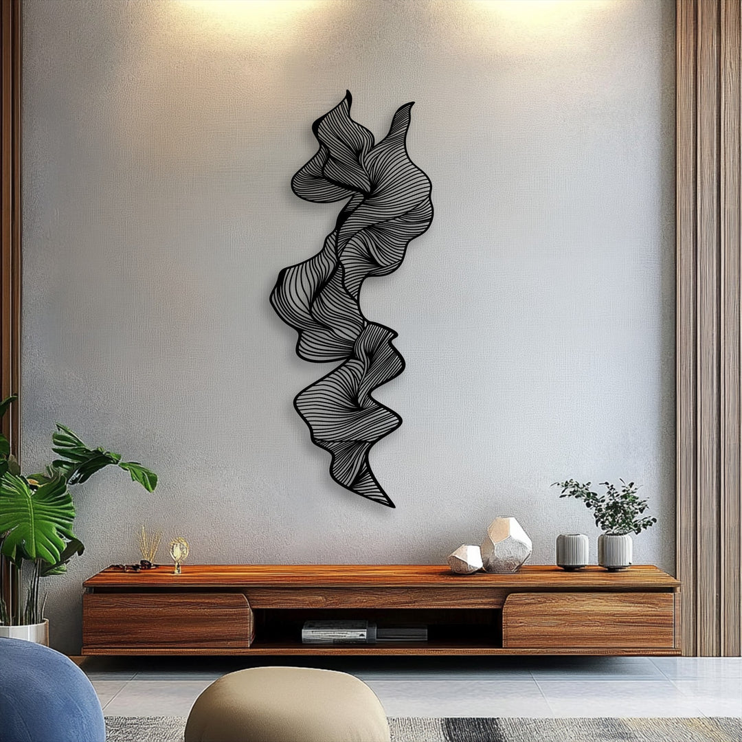 The realistic detail of the vertical abstract flow metal art for wall highlights its intricate line sculpture casting subtle shadows, adding depth.