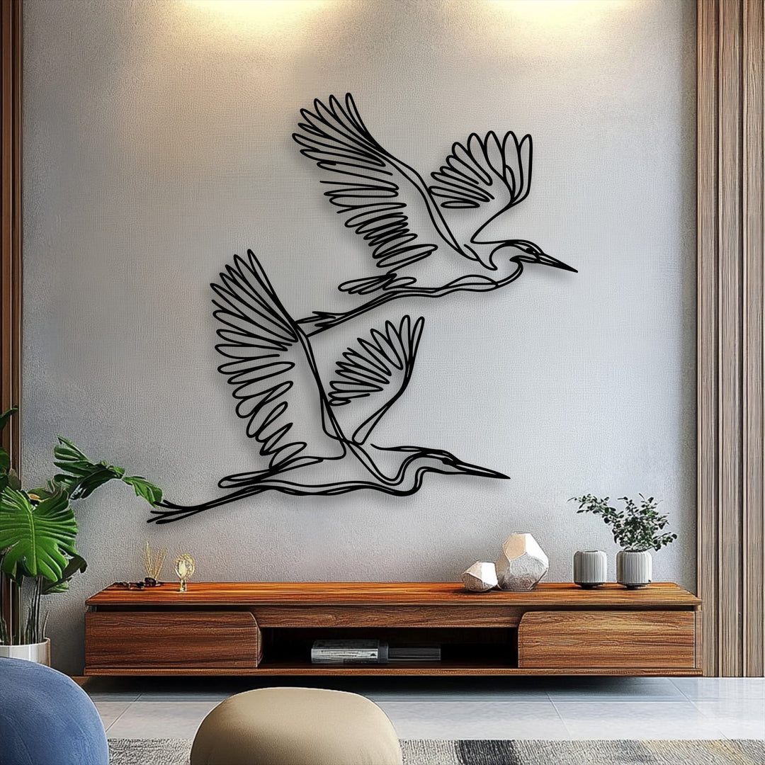The room's focal point is striking minimalist metal wall art featuring graceful flying herons, an exquisite piece of decoration wall art.