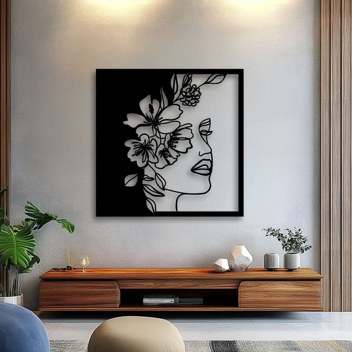 The distinct black frame of the elegant floral woman line art metal decoration wall art clearly defines its minimalist borders.