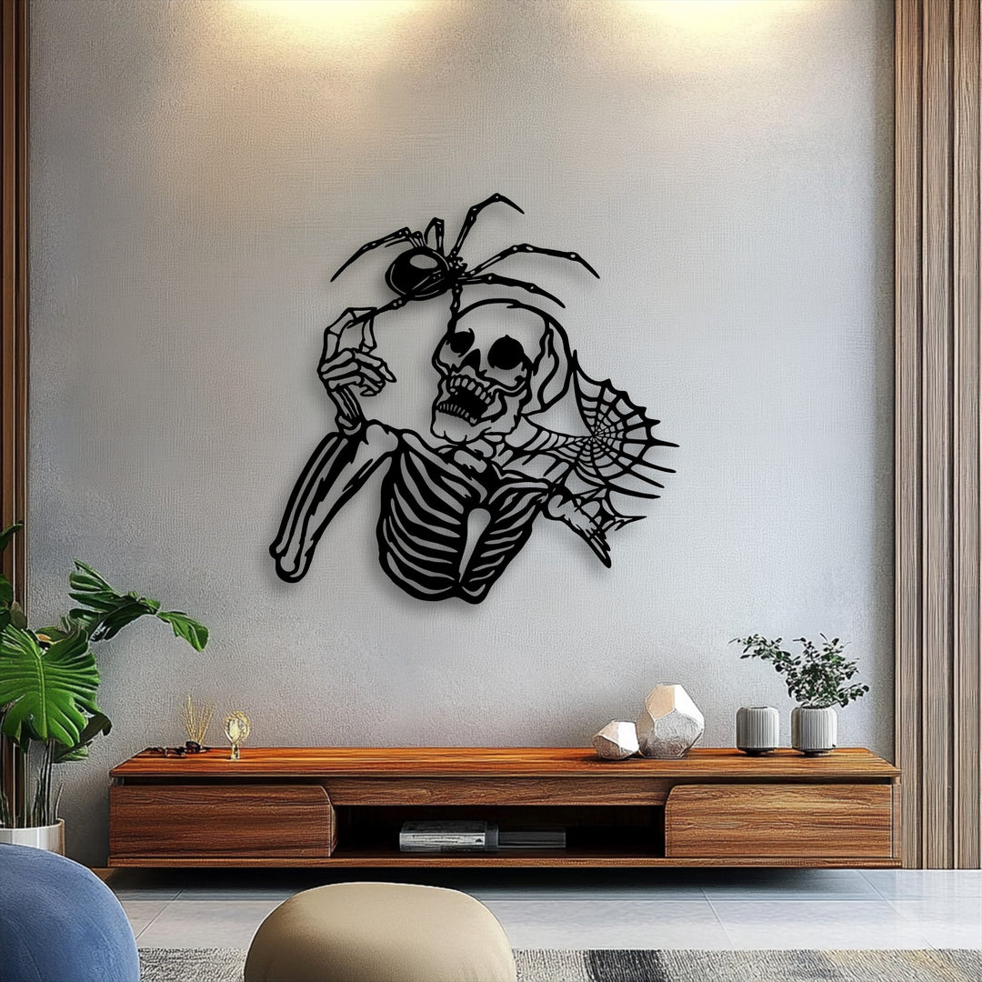 A light off-white wall showcases unique metal wall art featuring a gothic skeleton and spider, perfect for dark aesthetic horror decor.