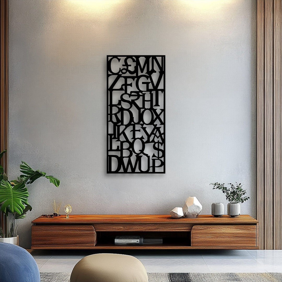 A soft, rounded beige upholstered pouf contributes to the cozy feel of the room featuring abstract alphabet grid decorative metal art.