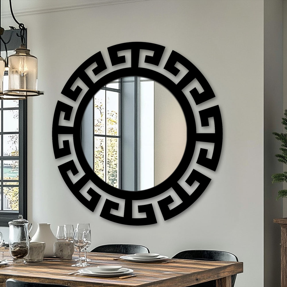 Reflection in this decorative mirror shows the scene outside the window, softened by the light filtering through, contrasting with the bold, black metal wall decor.