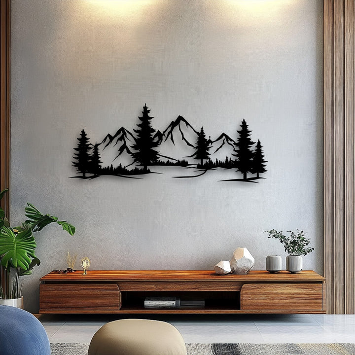 The detailed black metal art for wall, showcasing a majestic mountain forest landscape, is the loudest element in this stylish room.