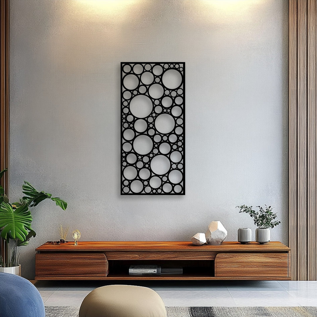 Featuring a sleek matte black finish, this decorative metal art displays a modern geometric circle pattern panel.