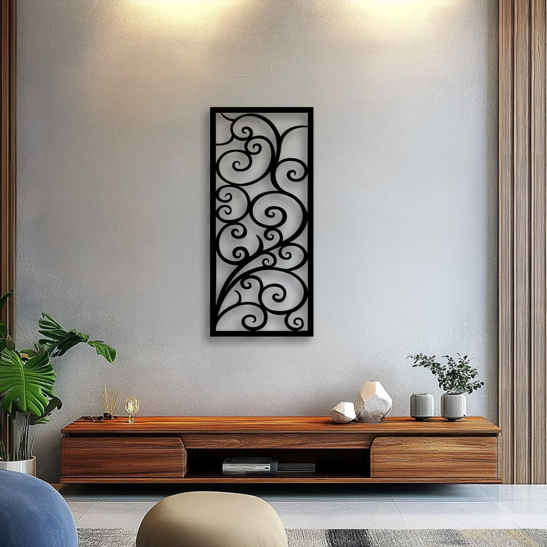 The textured light grey wall, illuminated by warm overhead lights, features a striking metal artwork with an elegant scroll pattern and vine design.