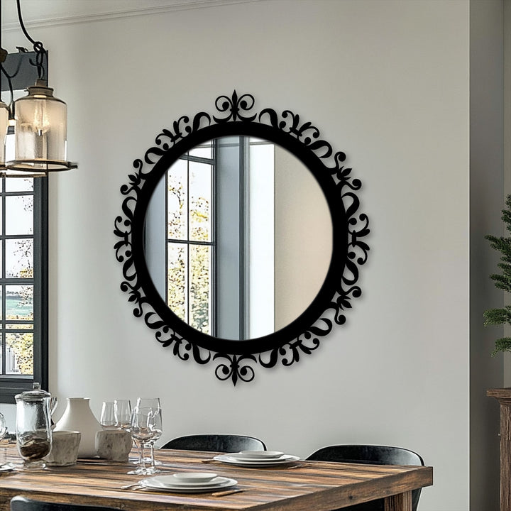 Beyond the ornamental baroque round mirror, the background includes a window and neutral-toned wall in a space that benefits from decorating with wall mirrors.