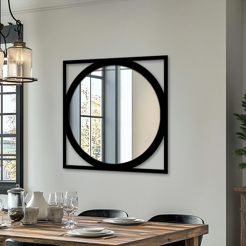 Visual rhythm is created by the geometric design of this stained glass wall mirror with its striking round glass and square black decorative metal art frame.