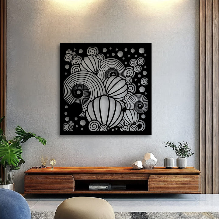 A striking square metal artwork featuring abstract balloons and swirling spirals in a captivating black and silver design.