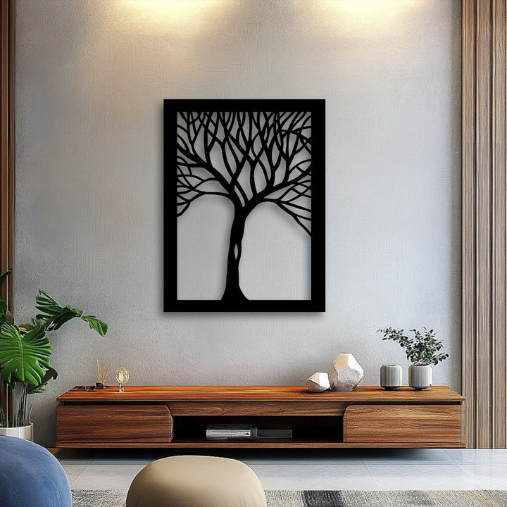 The realistic detail of the intricate black tree silhouette in this framed metal art for wall contrasts sharply with the subtly textured wall.