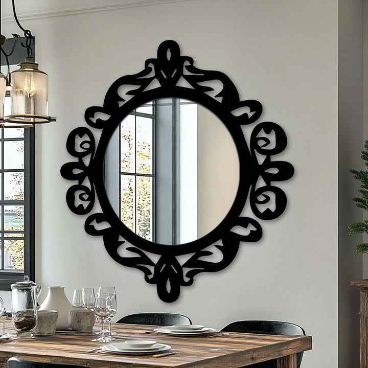 Soft reflections fill the round mirror, enhancing its ornate black metal frame and adding a touch of elegance to this decorative modern wall mirrors.