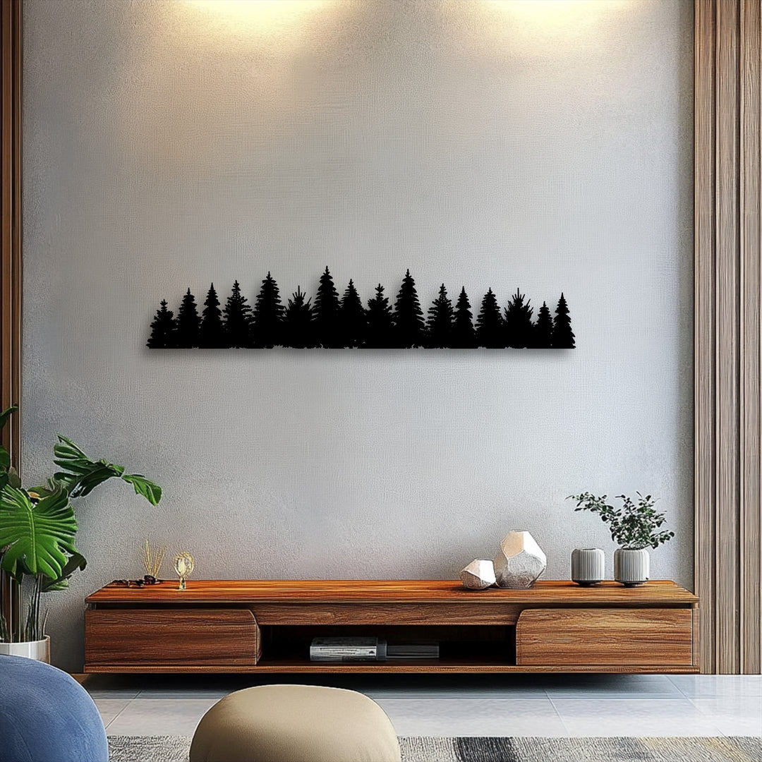 Focusing on the decorative metal art, the striking pine forest silhouette serves as the minimal nature decor's focal point on a light wall.