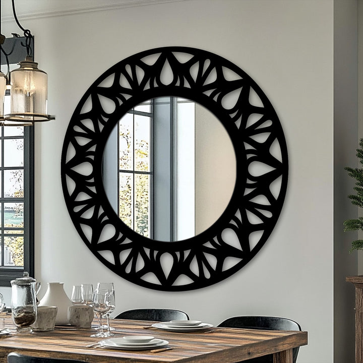 Featuring a smooth black finish, this floral cutout round modern mirror adds an elegant statement design to any room.