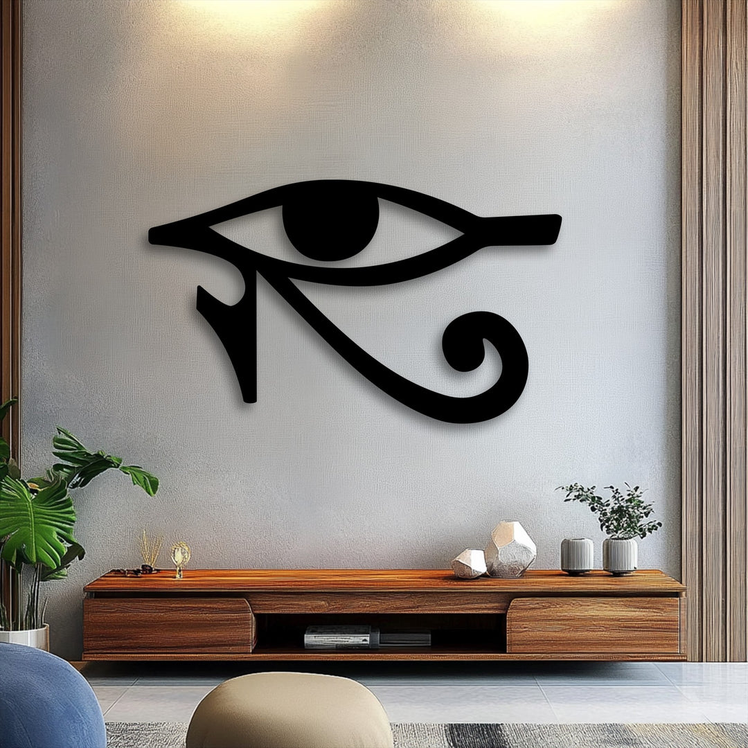 The Eye of Horus Symbol metal artwork features low color saturation, presenting a stark black design against muted grey and warm wood tones.