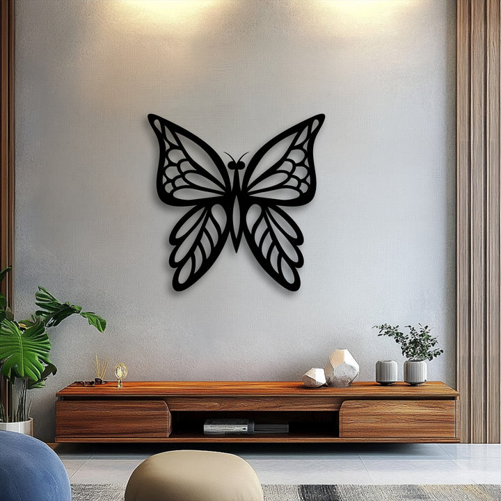 The brightly illuminated upper wall highlights the elegant black butterfly silhouette metal wall decor, providing a captivating focal point.