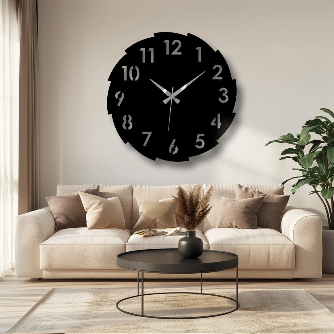 Understated color saturation highlights the modern segmented number design in this bold metal artwork clock, displayed above neutral furniture.