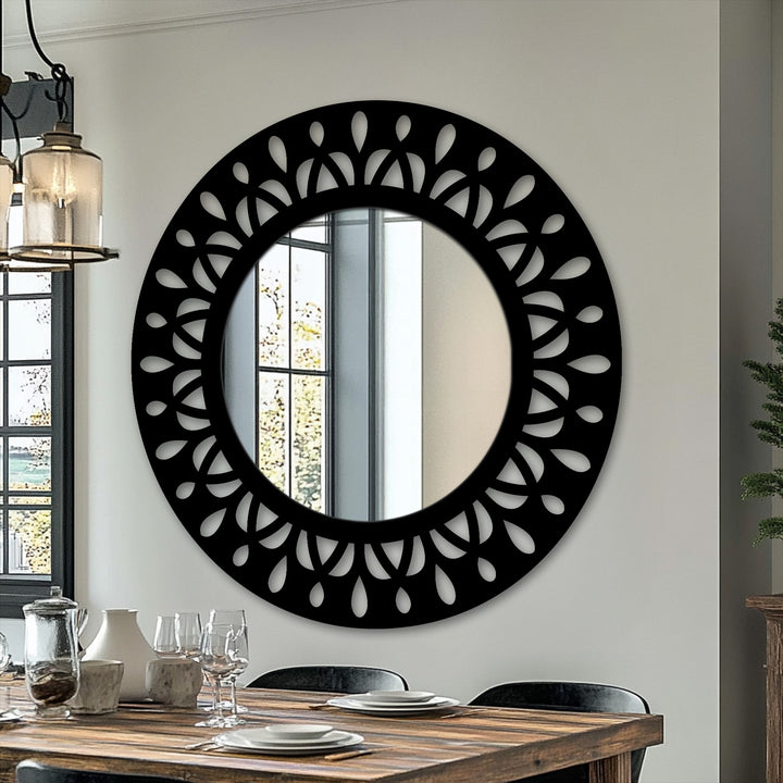 The background features a pristine white wall, elegantly showcasing a stylish black decorative mirror that reflects a sunlit window and a dining room scene.