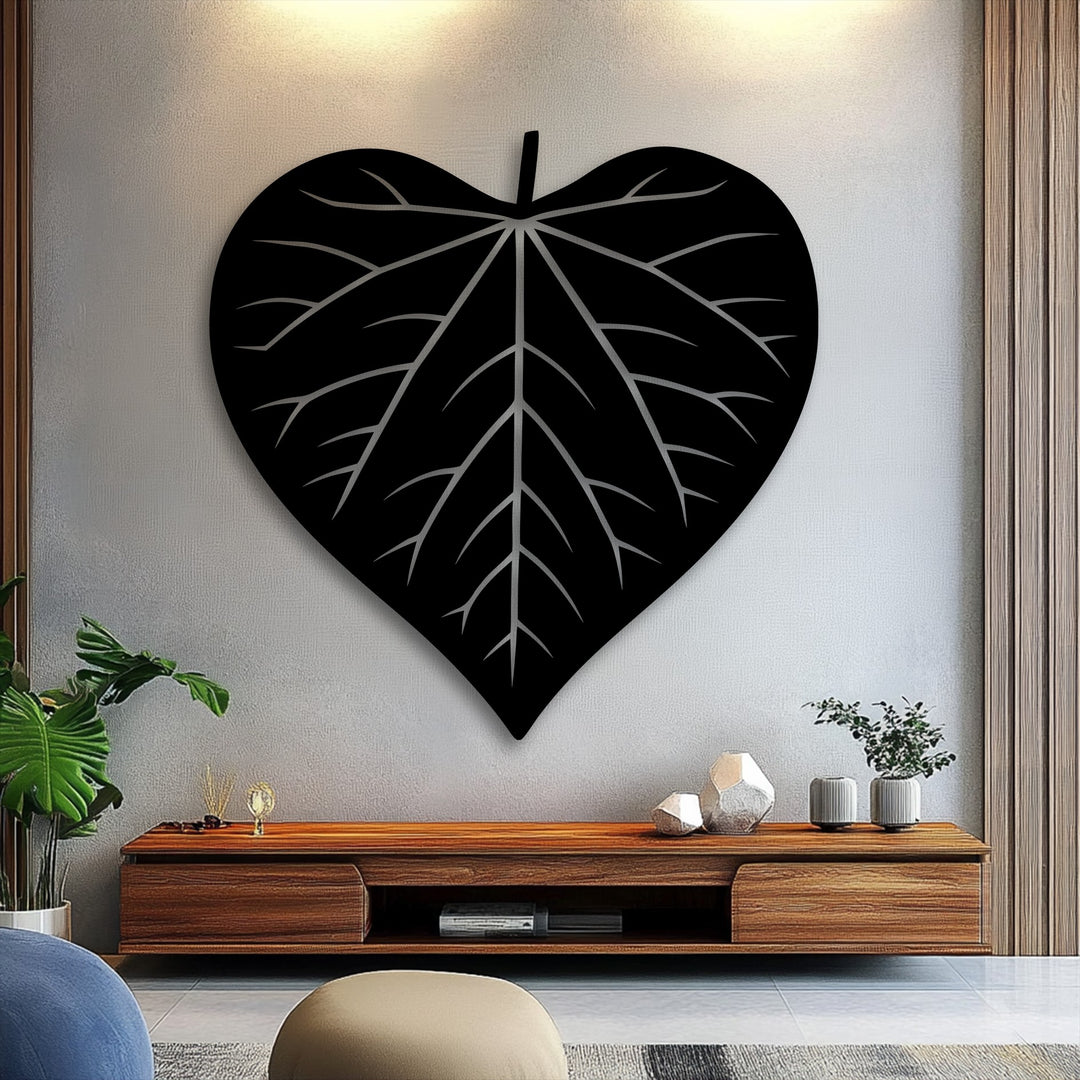 A striking unique metal wall art, this Nature Heart leaf silhouette features a large black design with intricate vein detailing.