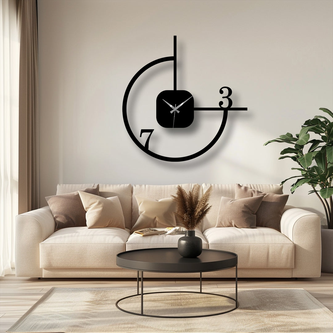 Soft, inviting pillows accentuate the minimalist geometric metal wall clock, enhancing the home decor with its modern abstract circle design.