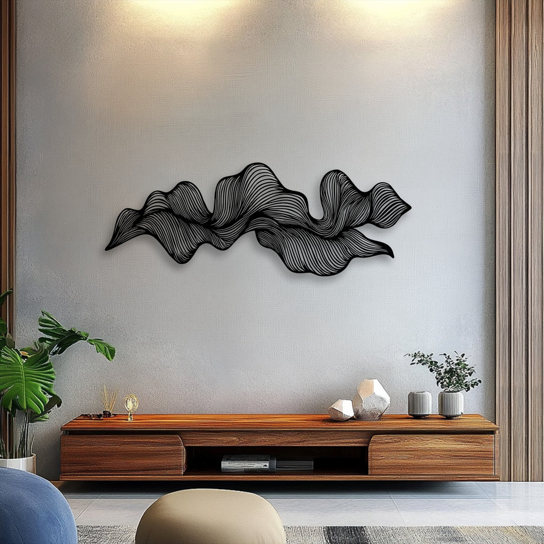 The brightest area of the textured wall highlights the intricate, flowing lines of the modern abstract wave metal decoration wall art.
