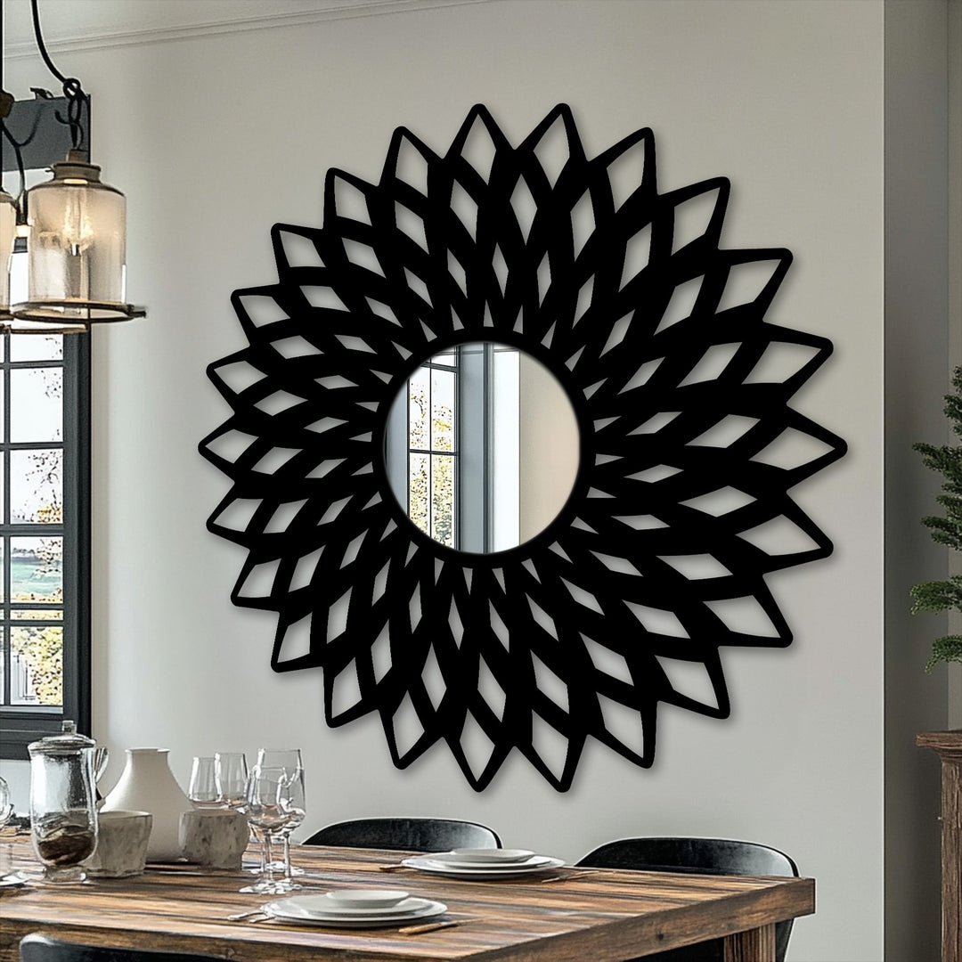 Radiating spokes create a striking sense of movement in this geometric flower mirror for wall decor, offering a focal point with its dynamically stylized, black frame.