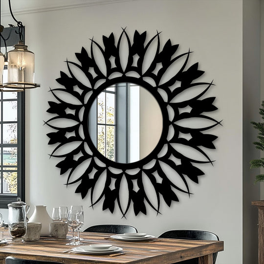 Featuring a finely textured surface texture, this floral sunburst stained glass wall mirror has an intricate black frame.