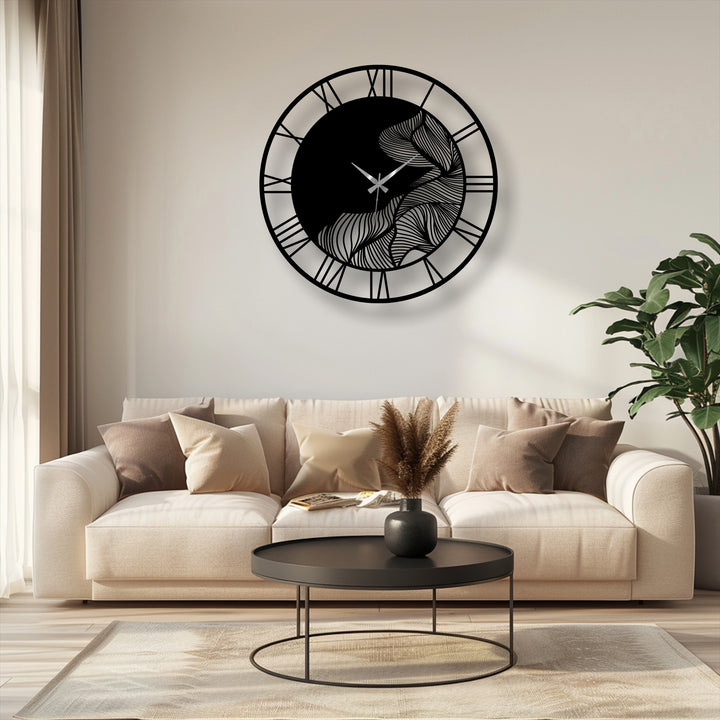 Highlighting the edge and borders, this unique metal wall art clock features an abstract leaf design framed by a black border with elegant Roman numerals.