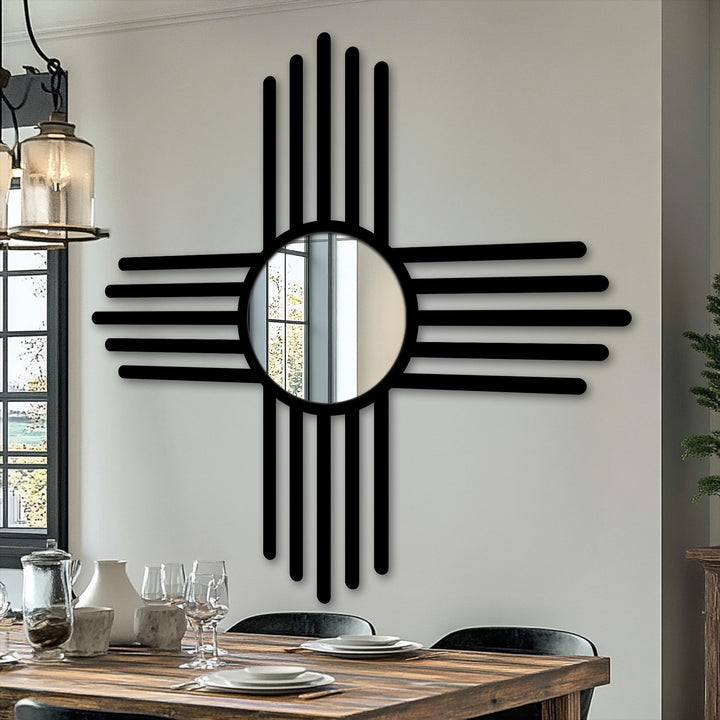 Foreground shows the wooden dining table set with plates and glasses beneath the minimal cross line floor mirror as an example of decorating with wall mirrors.