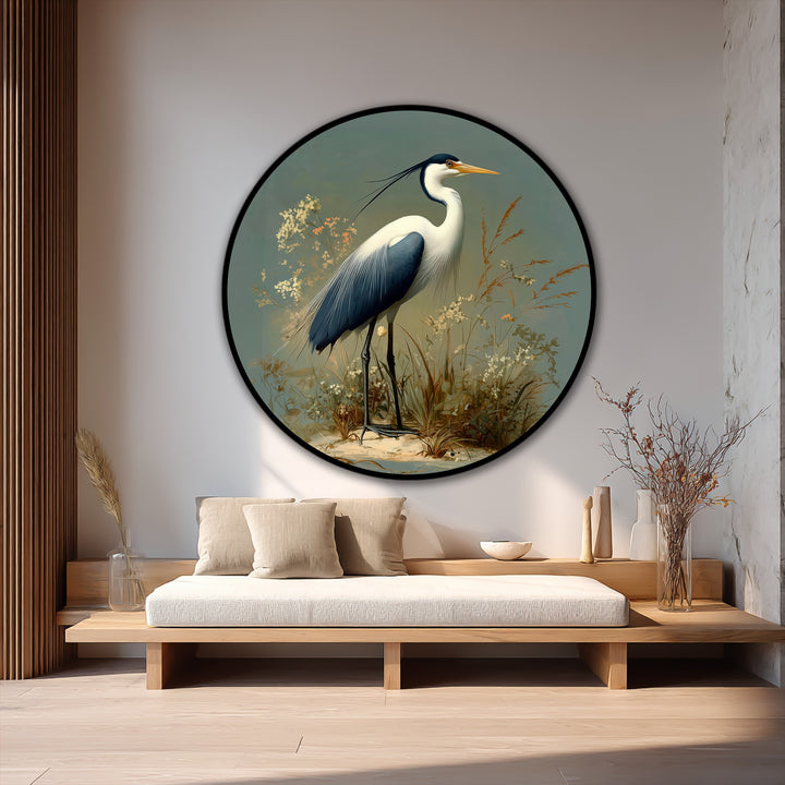 Layering elements create a tranquil effect in this oil painting art piece, showcasing a majestic heron framed by delicate foliage and a circular canvas.