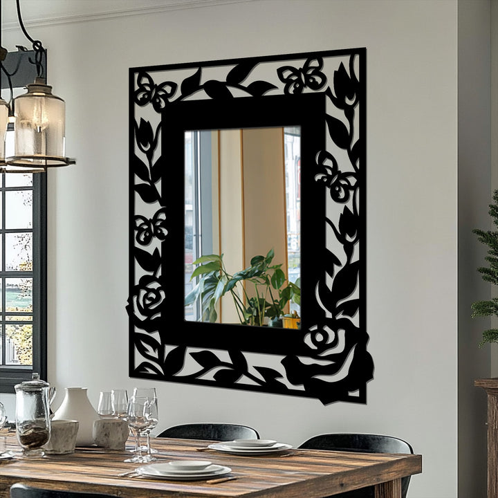 Framed with butterflies and roses, the elegant floral butterfly frame metal art for wall design surrounds a reflective mirror for an eye-catching accent.
