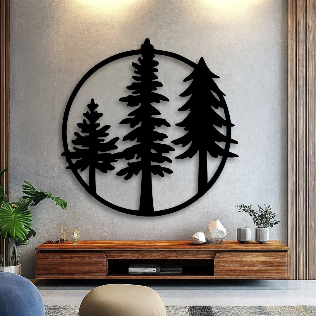 The elegant layering effect of this circular metal artwork showcases three distinct evergreen pine trees silhouetted within a minimalist black frame.