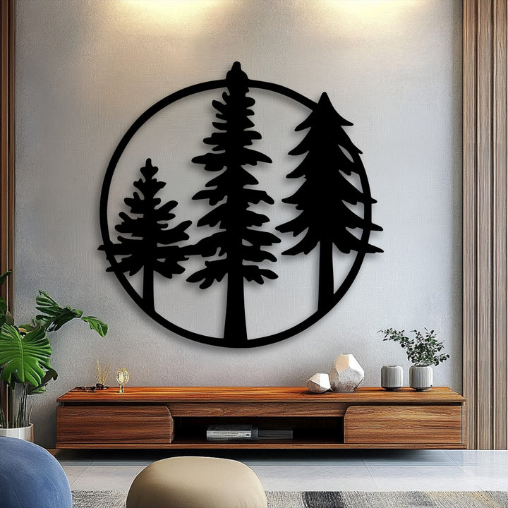 The elegant layering effect of this circular metal artwork showcases three distinct evergreen pine trees silhouetted within a minimalist black frame.