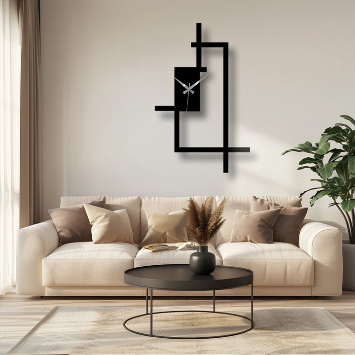 High color contrast accentuates the black abstract line frame metal art for wall clock mounted above a neutral sofa in a contemporary room setting.