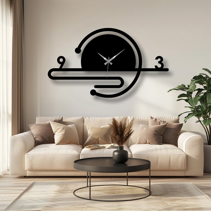 Centered on the wall, the minimalist orbit line metal wall clock highlights a piece of decorative metal art above a beige couch.