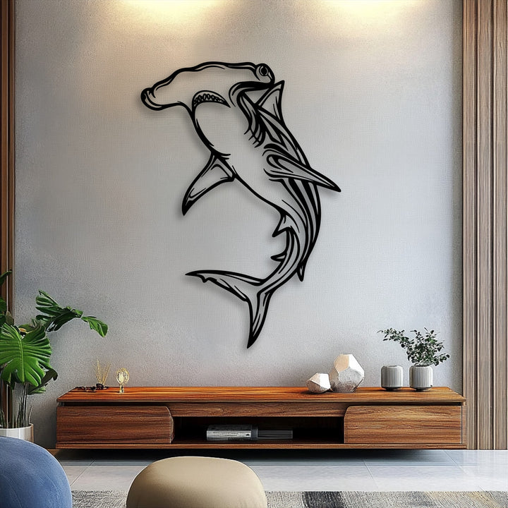 The striking black hammerhead shark metal wall art creates a captivating sense of depth and shadow against the textured wall, serving as unique decoration wall art.