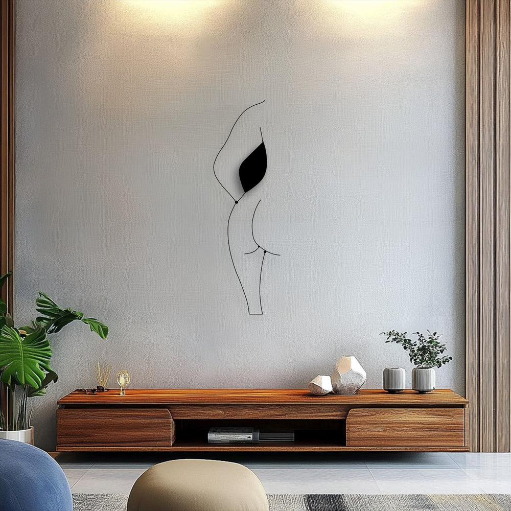 The muted color saturation beautifully accentuates the minimalist female silhouette line art, a modern metal decoration wall art piece.