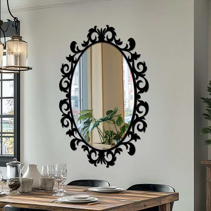 Black is the dominant color in this imperial scroll leaf oval floor mirror, which features ornate metal wall decor in a classic design.