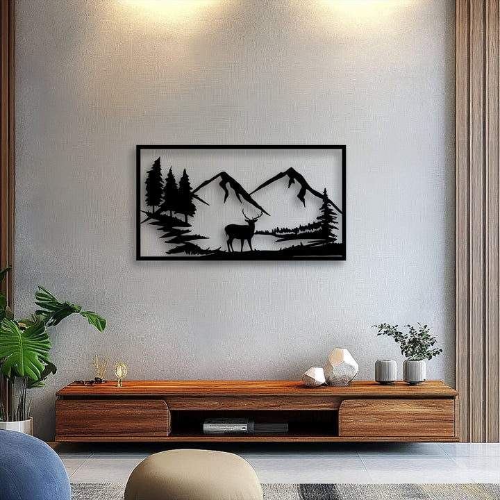 The background showcases a textured light gray wall, providing a neutral canvas for the majestic mountain deer silhouette metal artwork.
