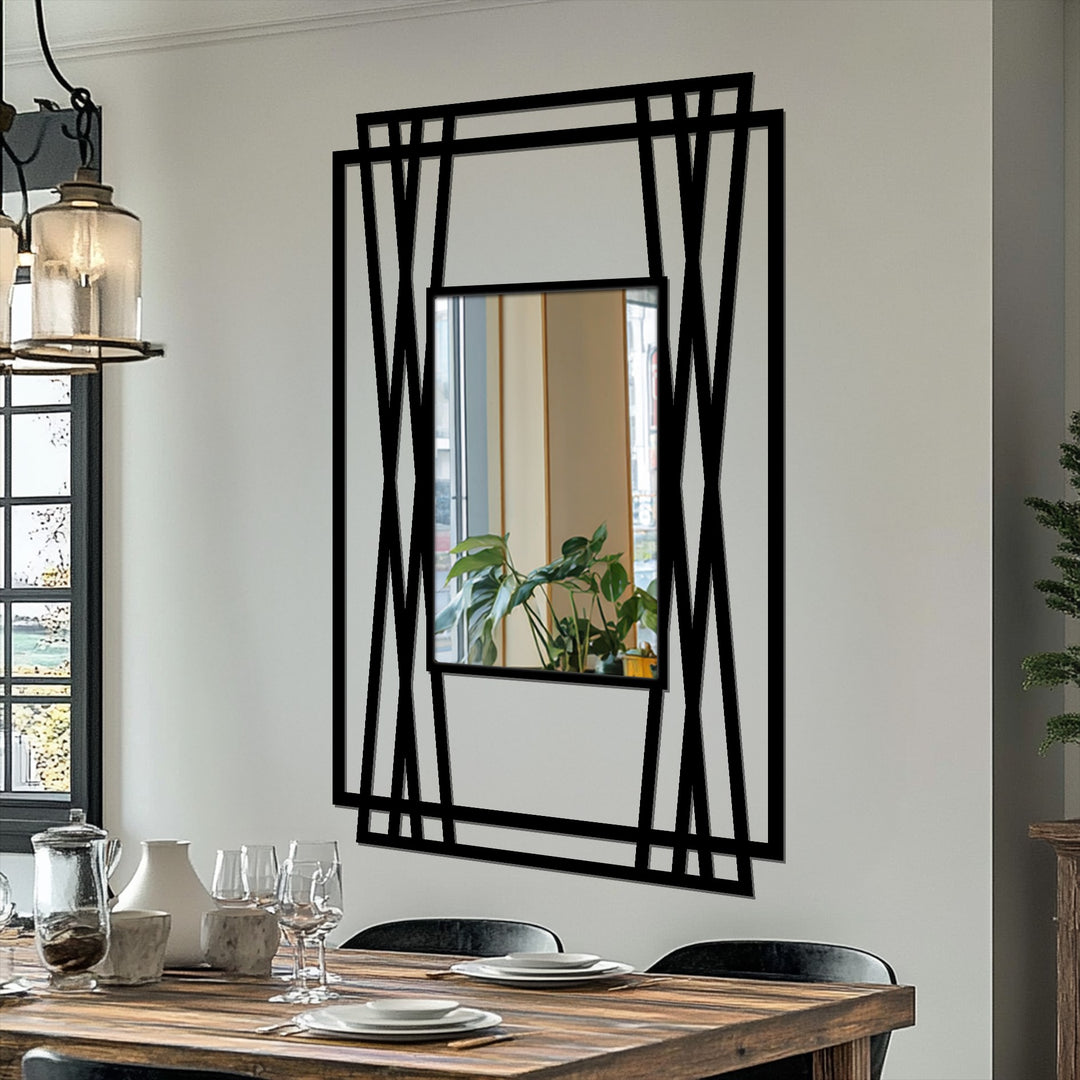 Reflected softly within the glass of the vertical line geometry framed wall mirror is a potted plant, contrasting with the strong modern metal art for wall frame.
