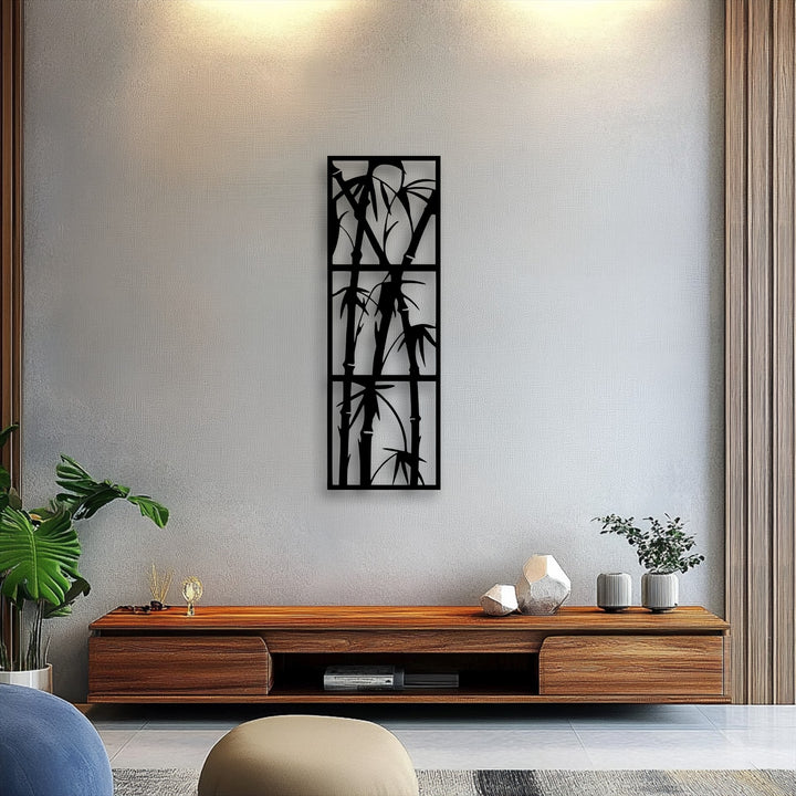 A softly textured beige pouf anchors the minimalist room, featuring a striking bamboo metal decoration wall art.